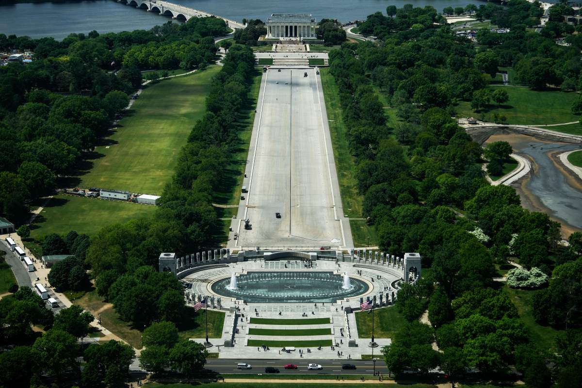 Work continues on cleaning the drained Lincoln Memorial Reflecting Pool ahead of America 250, Monday, April 20, 2026, in Washington.