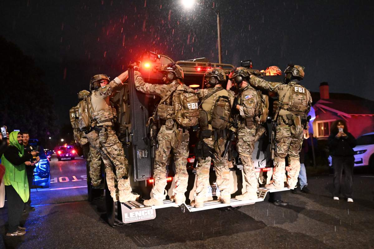 FBI officers leave the scene after responding to an address connected to Cole Tomas Allen, the shooting suspect at the White House Correspondents Dinner on Sunday, April 26, 2026, in Torrance, Calif.