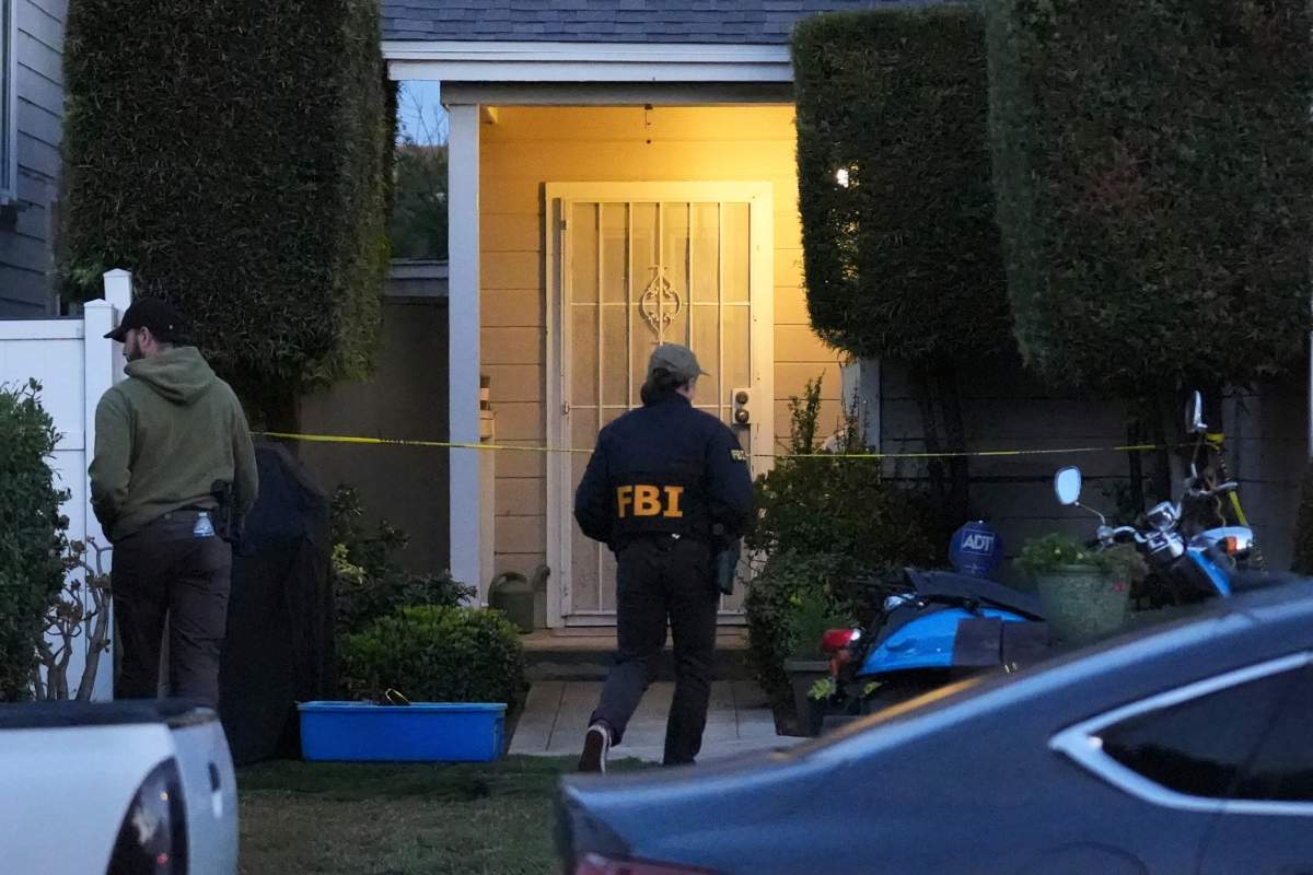 FBI agents work Sunday, April 26, 2026, at an address in Torrance, Calif., connected to Cole Tomas Allen, who was identified as the shooting suspect at the White House Correspondents Dinner the night before.