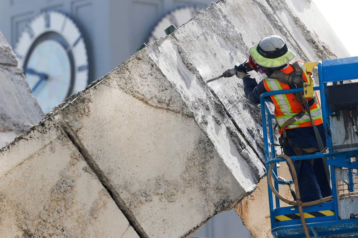 Construction crews begin to dismantle the Vaillancourt Fountain at the Embarcadero Plaza, Monday, April 27, 2026, in San Francisco.
