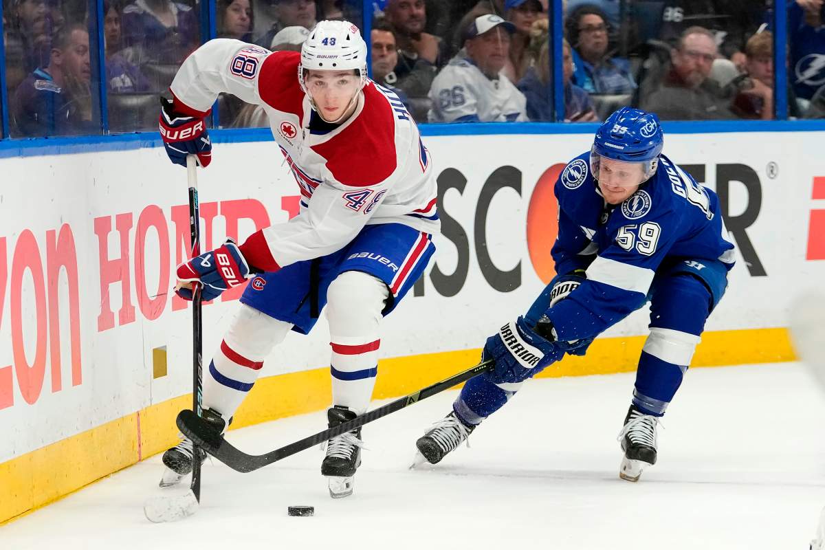 Montreal Canadiens defenceman Lane Hutson (48) controls the puck against Tampa Bay Lightning centre Jake Guentzel (59) during the second period in Game 5 of an NHL hockey Stanley Cup first-round playoff series, Wednesday, April 29, 2026, in Tampa, Fla.