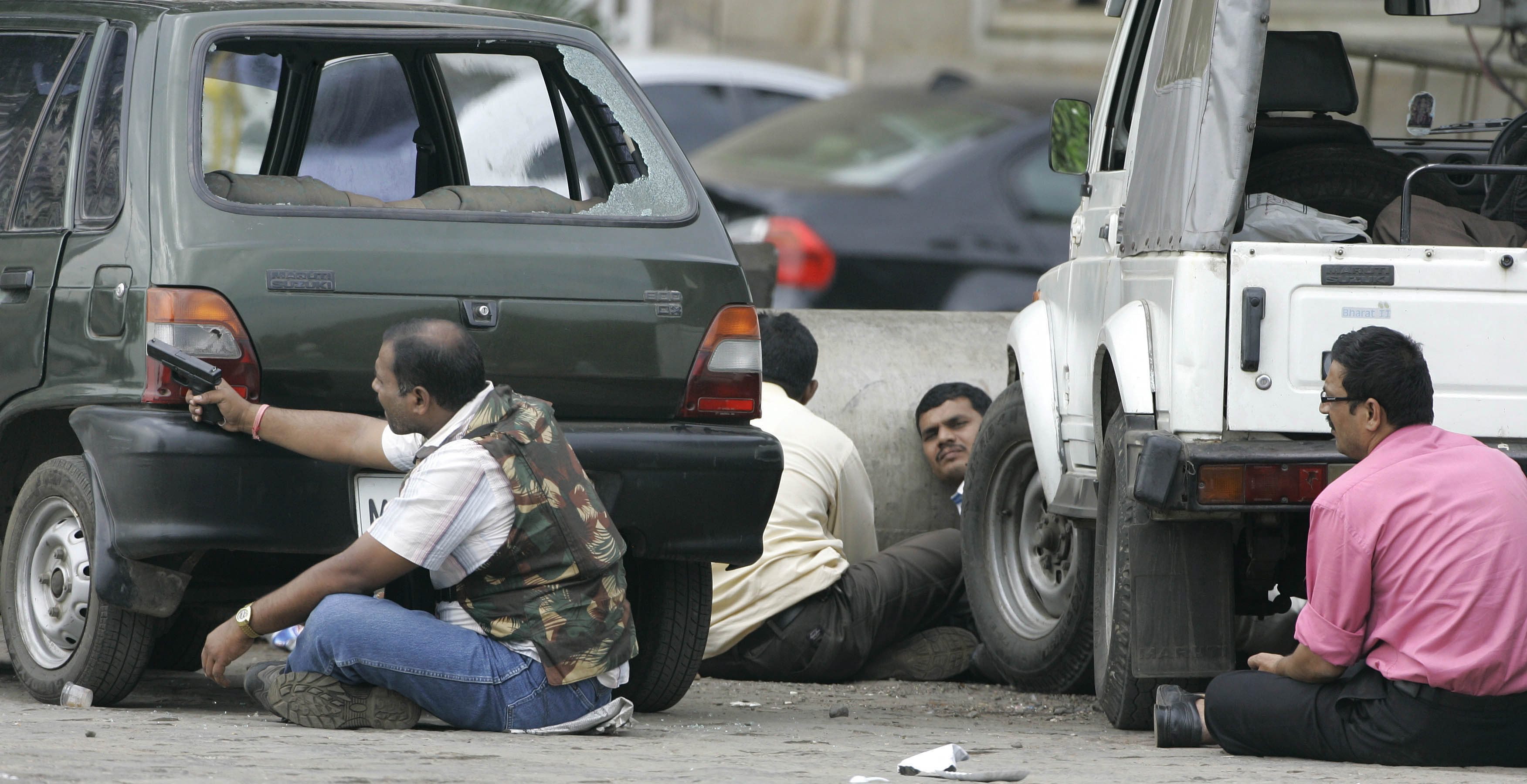 Anti-terrorist squad takes cover during the 2008 terrorist attack in Mumbai, India, that killed 166. (AP Photo/Rajanish Kakade)