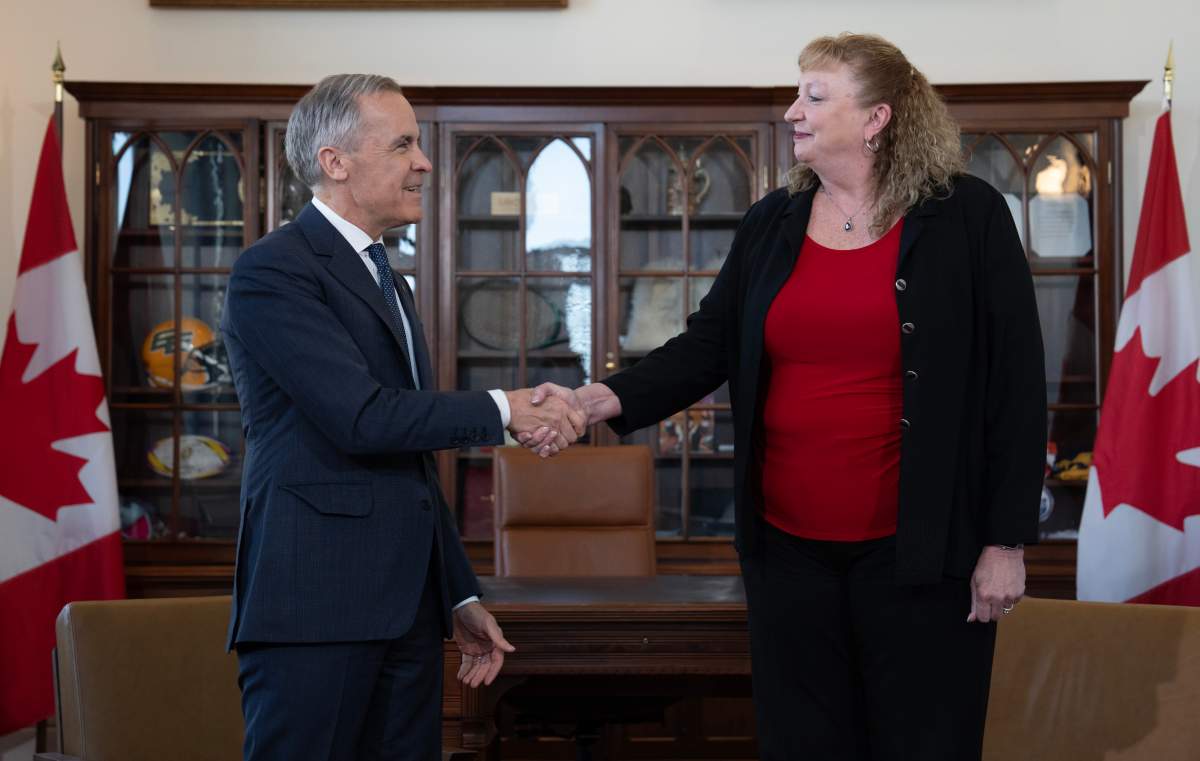 Prime Minister Mark Carney shakes hands with MP for Sarnia-Lambton-Bkejwanong Marilyn Gladu in Ottawa, Wednesday, April 8, 2026.