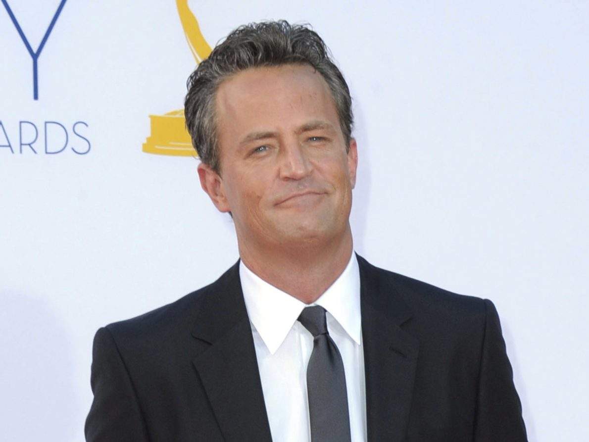 FILE - Actor Matthew Perry arrives at the 64th Primetime Emmy Awards in Los Angeles on Sept. 23, 2012. (Photo by Jordan Strauss/Invision/AP, File).