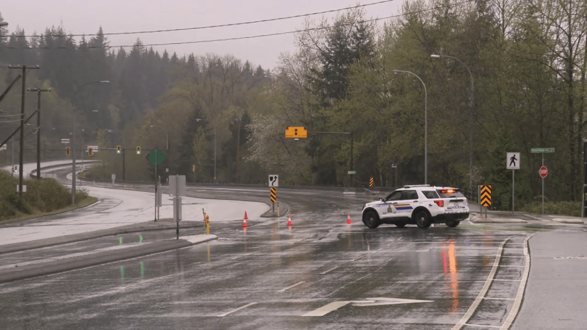 Burnaby RCMP on the Barnet Highway after a fiery crash on Tuesday morning.