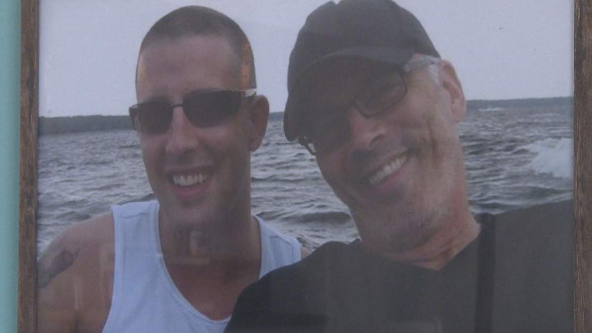 A photo of Scott Oake and his son, Bruce, hangs in the family room at the Bruce Oake Recovery Centre.