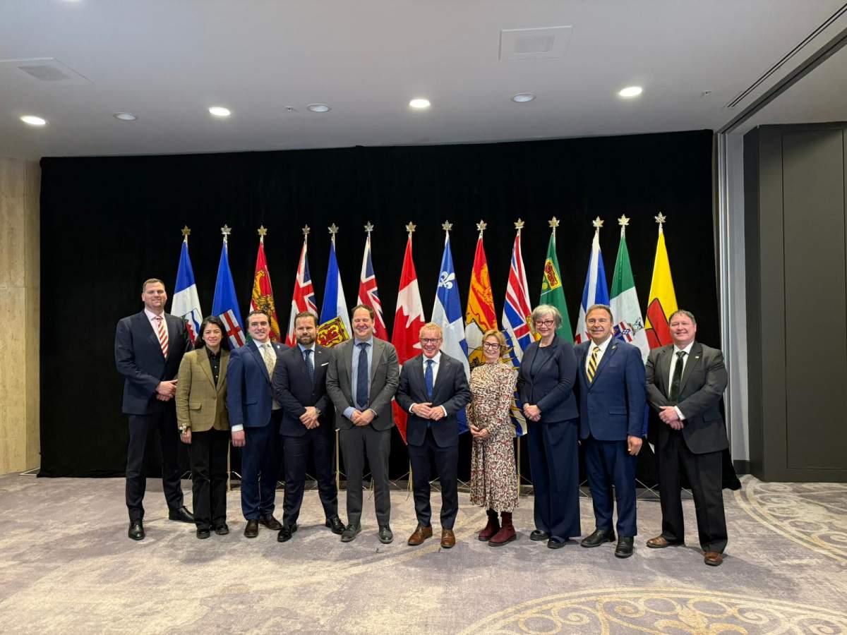 Labour ministers from multiple provinces and territories stand for a photo during a meeting April 10 on harmonizing workplace training standards.