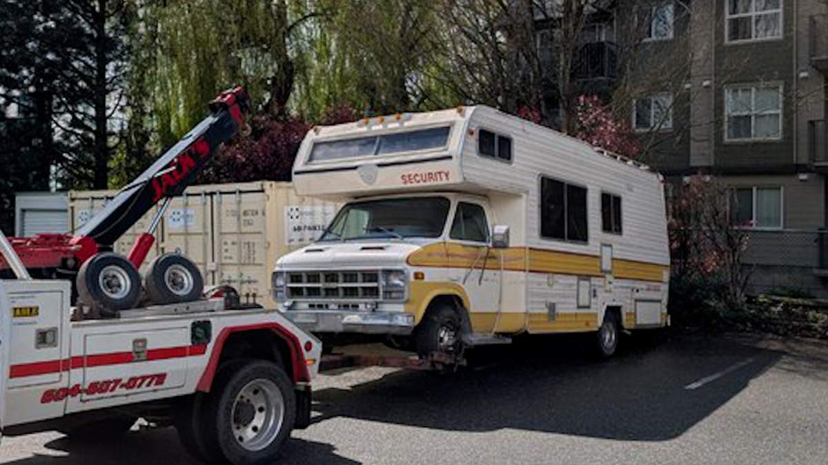 A motorhome is towed away after being seized by police in Abbotsford following an attempted traffic stop that led to multiple charges.