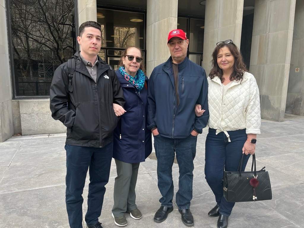 The family of Carlos Dinis is pictured outside court on Thursday, April 30, 2026.