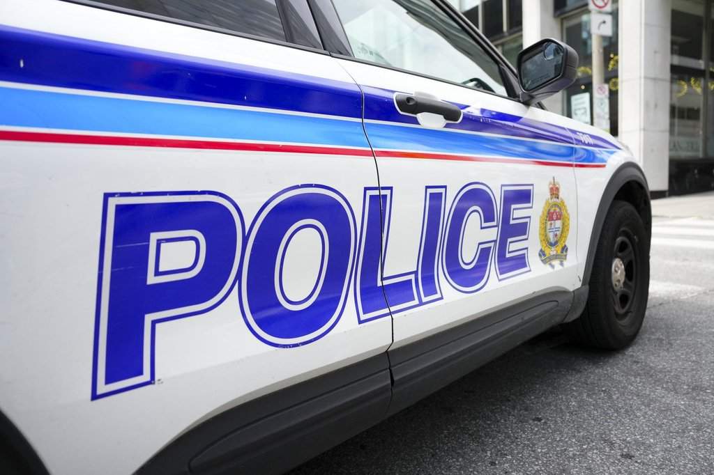 An Ottawa Police Service cruiser is parked at a scene in downtown Ottawa.