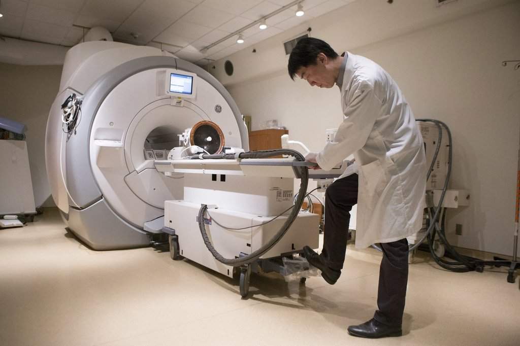 A member of a medical team prepares a MRI machine before a procedure at Toronto's Sunnybrook Hospital on Tuesday May 1, 2018. THE CANADIAN PRESS/Chris Young.