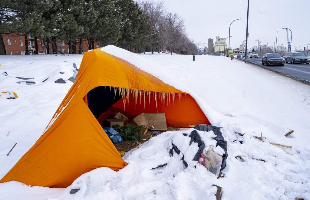 Tents are seen at an unhoused encampment in Montreal on Friday, Feb. 27, 2026. THE CANADIAN PRESS/Christinne Muschi.