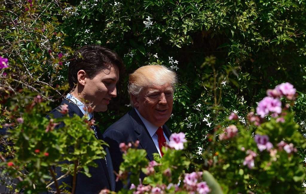 Prime Minister Justin Trudeau and U.S. President Donald Trump walk together during the G7 Summit in Taormina, Italy on Saturday, May 27, 2017. THE CANADIAN PRESS/Sean Kilpatrick.
