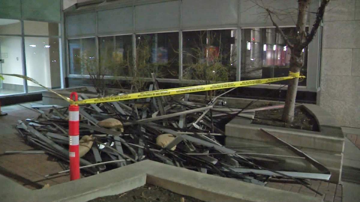 A pile of crumpled siding and other metal pieces from one of the puls-15 walkways in Calgary that was toppled by the wind overnight.