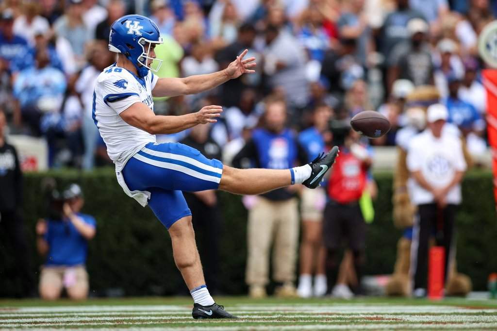 Kentucky kicker Aidan Laros (48) punts the ball during the first half of an NCAA college football game against Georgia, Saturday, Oct. 4, 2025, in Athens, Ga. (AP Photo/Colin Hubbard).