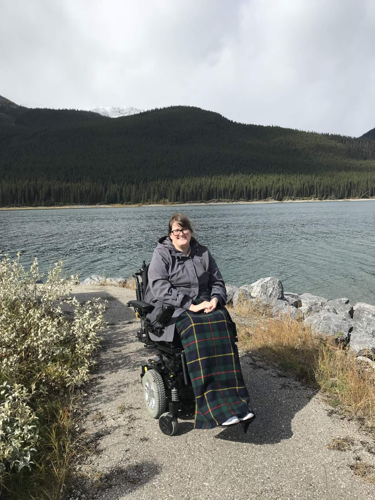 Undated photo of Jessie Ravnsborg in a wheelchair by a lake.