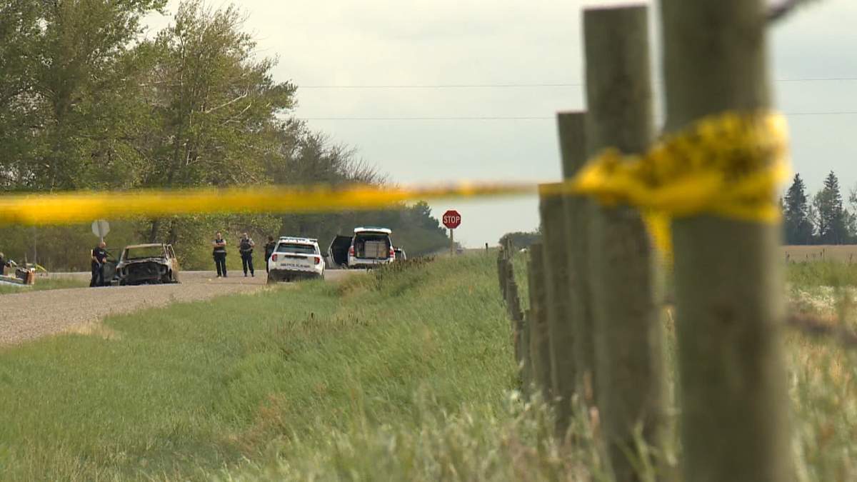 Police tape surrounds the scene of a fatal shooting in Rocky View County about seven kilometres east of Calgary in August 2024.