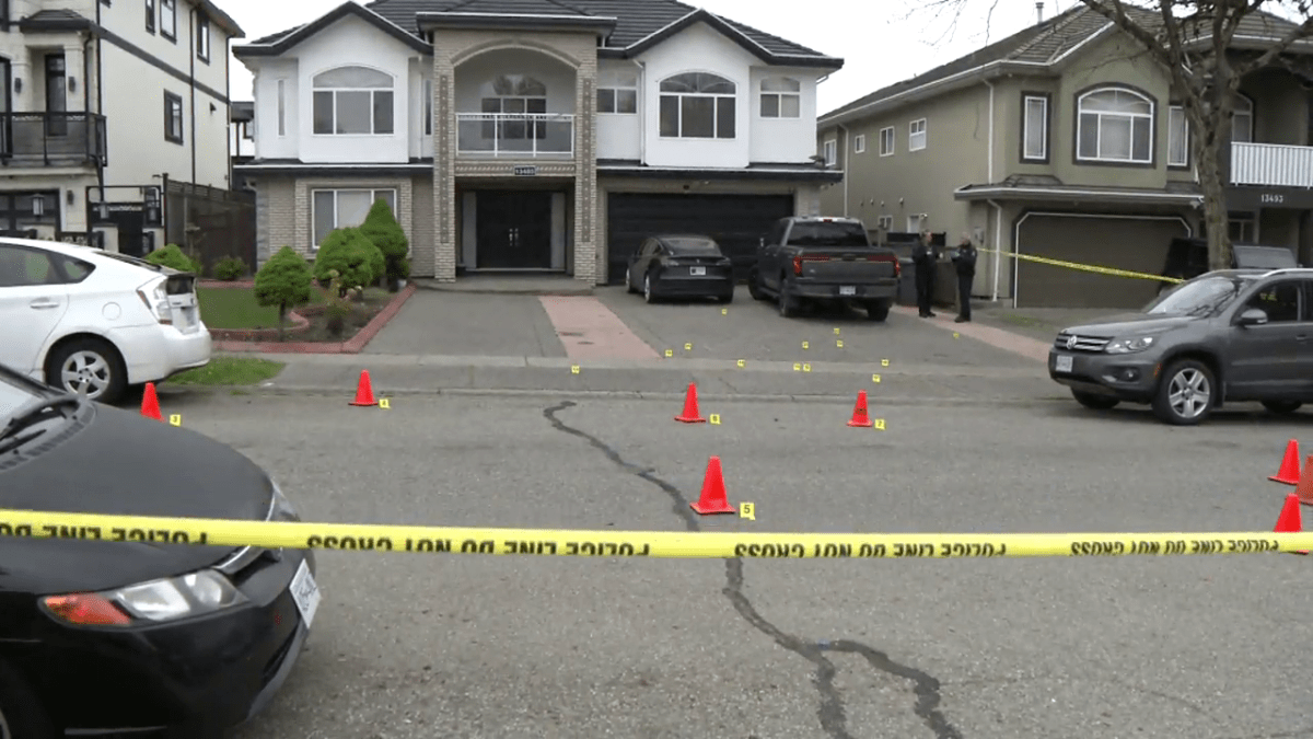 The home on 87A Avenue in Surrey was behind police tape on Wednesday morning, with evidence markers on the ground.