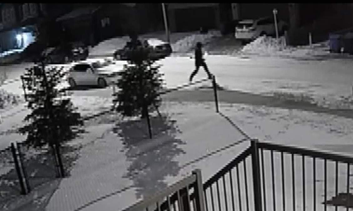 This photo, taken from CCTV footage appears to show a suspect running away from the scene of one of the 18 extortion shootings police say have taken place.