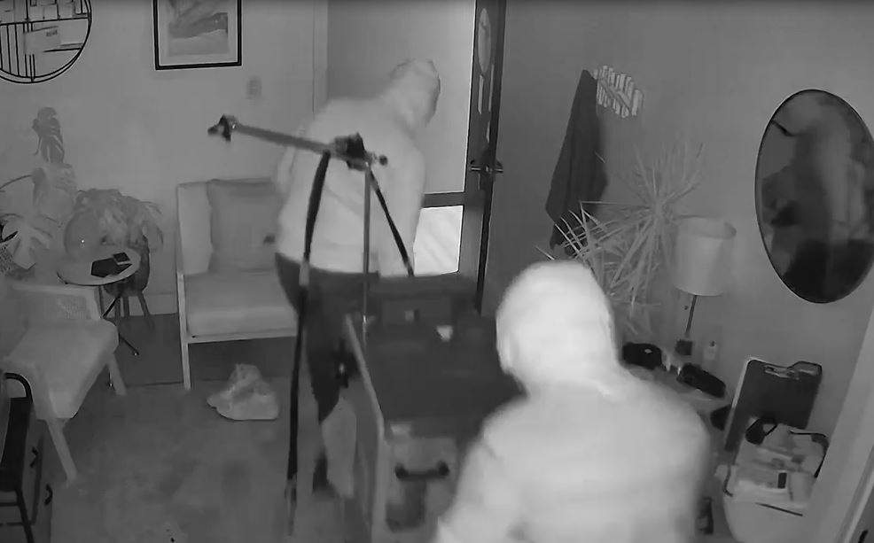 This photo, taken from security camera video, shows the thieves wheeling the laser machine out of the salon before taking it down some stairs and across a parking lot before loading it into a van and making their get away.