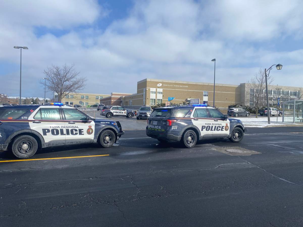 York Regional Police sit outside Pierre Elliott Trudeau High School after responding to a 'swatting call' on April 7, 2026.