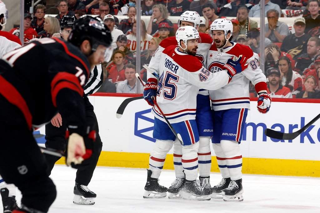Montréal Canadiens celebrate their third goal during the first period in Game 1 of the Eastern Conference finals NHL hockey Stanley Cup playoffs series against the Carolina Hurricanes in Raleigh, N.C., on May 21, 2026. (AP Photo/Karl DeBlaker).