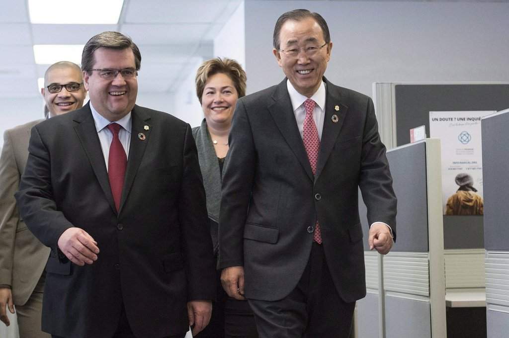 Montreal Mayor Denis Coderre, left, and United Nations Secretary General Ban Ki-moon talk as they tour an anti-radicalization centre in Montreal on Saturday, Feb. 13, 2016. THE CANADIAN PRESS/Graham Hughes.