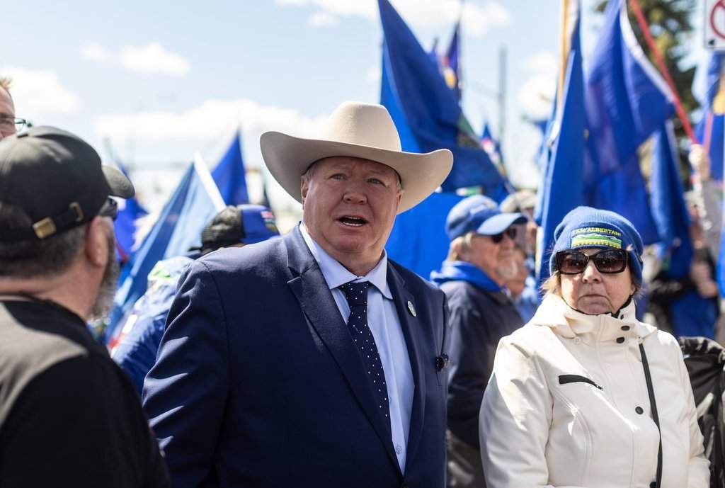 Jeffery Rath stands with supporters