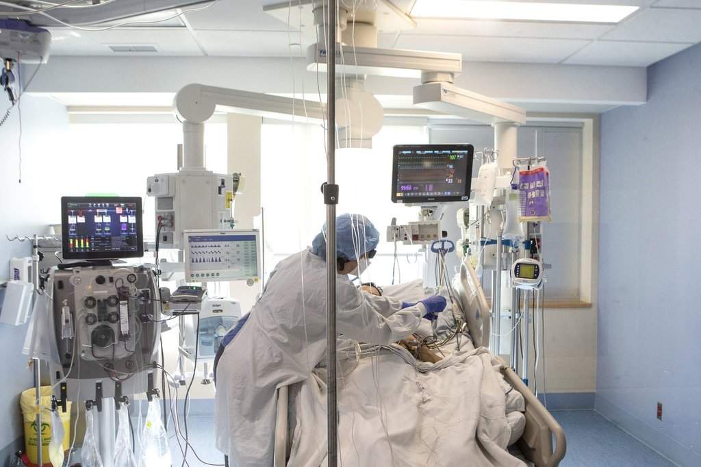 A nurse tends to a patient at the Bluewater Health Hospital in Sarnia, Ont., on Tuesday, Jan. 25, 2022. 