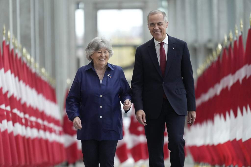 Prime Minister Mark Carney walks with Louise Arbour to announce the new governor general during an event in Ottawa, Tuesday, May 5 2026.
