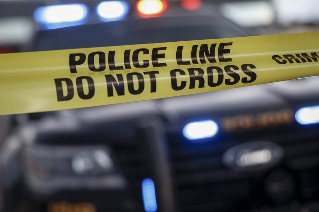 Police tape is shown. 