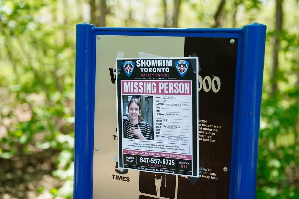 A poster of missing 14-year-old Esther is seen in Earl Bales Park in Toronto on Tuesday, May 19, 2026. THE CANADIAN PRESS/Arlyn McAdorey