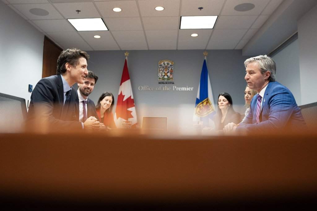 Prime Minister Justin Trudeau, left, Minister of Housing, Infrastructure and Communities Sean Fraser, second from left, meet with Nova Scotia Premier Tim Houston, right, in Halifax on Monday, Dec. 9, 2024. THE CANADIAN PRESS/Darren Calabrese.