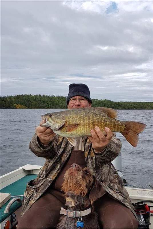 Russ Popp with a smallmouth bass in Nopiming Provincial Park.