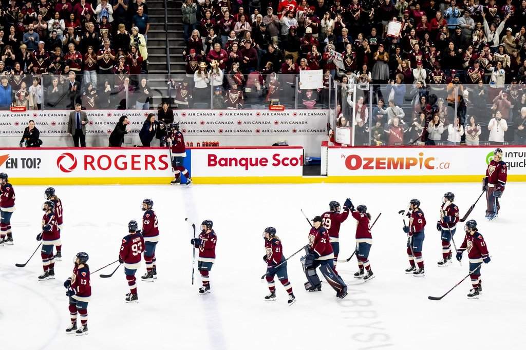 Montreal Victoire teammates celebrate after Montreal Victoire's Maggie Flaherty (91) scored against Ottawa Charge during overtime PWHL playoff hockey action in Laval, Que., on Saturday, May 16, 2026. THE CANADIAN PRESS/Christopher Katsarov.