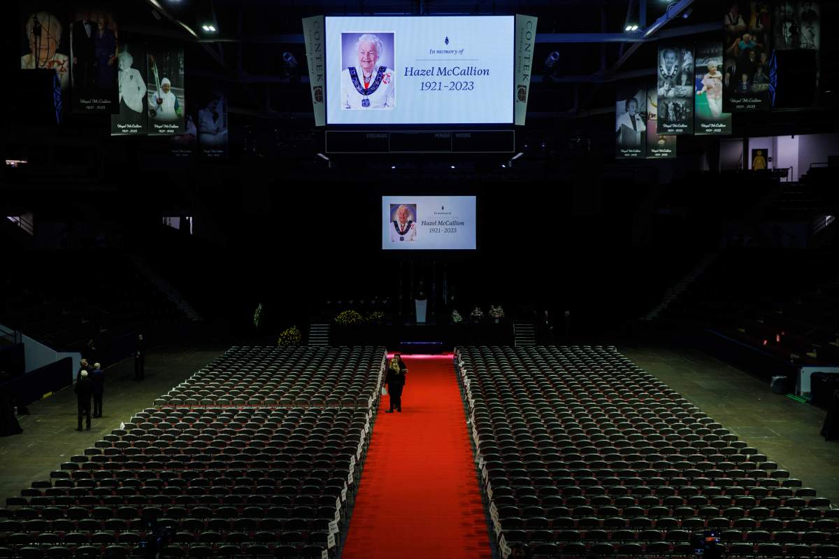 People walk about the venue before the funeral for former Mississauga mayor Hazel McCallion at the Paramount Fine Foods Centre in Mississauga, Ont., Tuesday, Feb. 14, 2023.