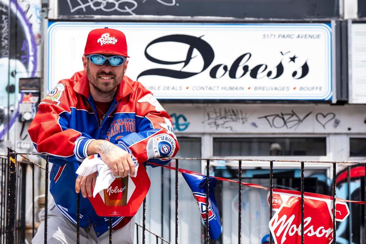 Victor-Alex Petrenko, co-owner of Double’s bar in Montreal poses for a photograph after temporarily re-naming the bar to Dobes, after the Montreal Canadiens goaltender Jakub Dobes, on Thursday, May 7, 2026. THE CANADIAN PRESS/Christopher Katsarov