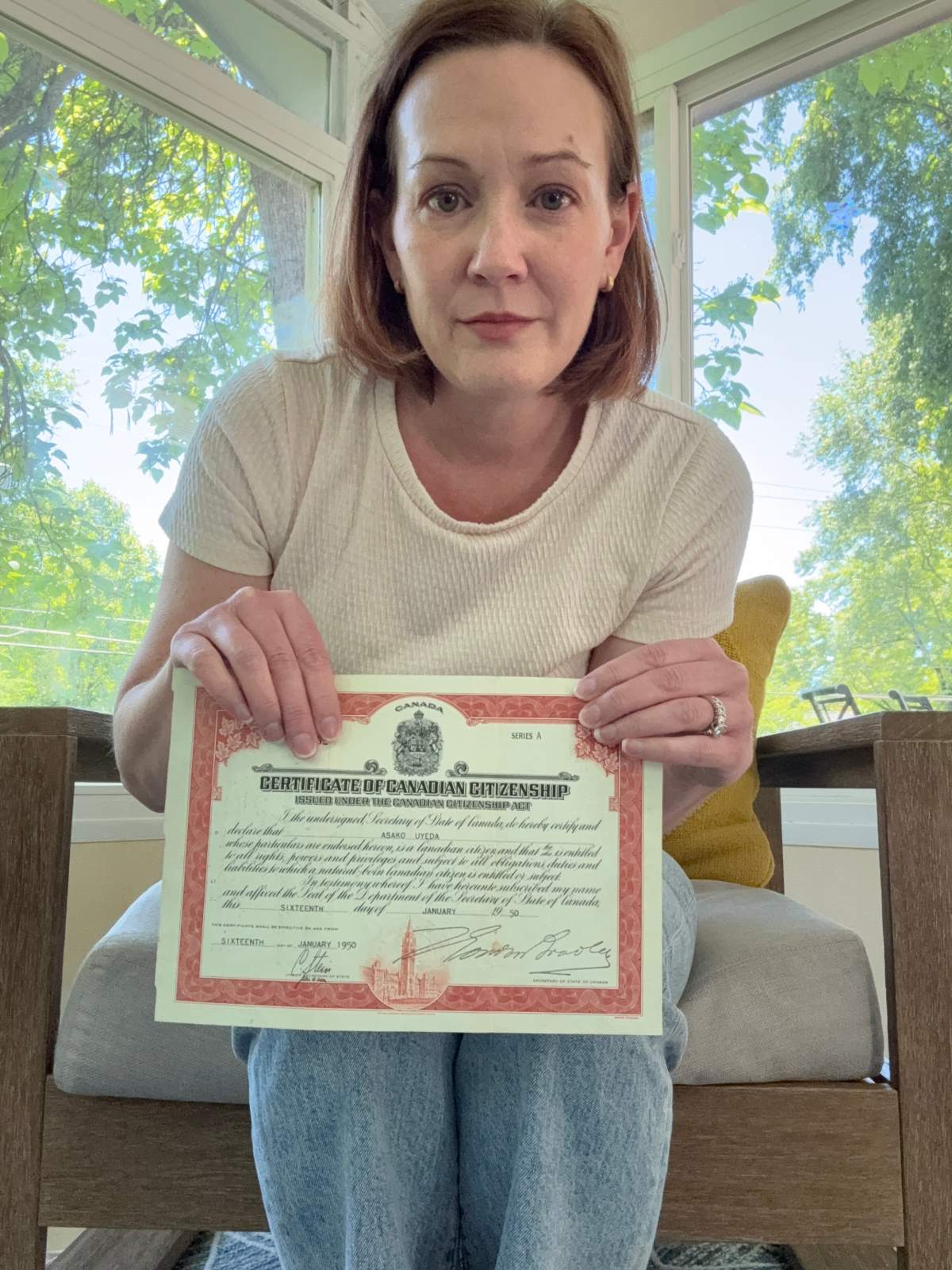 Mariam Watson from Indianapolis, Ind., holds the Canadian citizenship certificate of her grandmother, Asako Uyeda, who was born in New Westminster, B.C., in 1921 in this handout photo. Watson is seeking Canadian citizenship based on her grandmother's origins.
