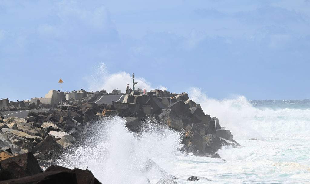 FILE: BALLINA, AUSTRALIA - MARCH 04: A man watches huge waves at North Wall caused by Cyclone Alfred on March 04, 2025 in Ballina, Australia.