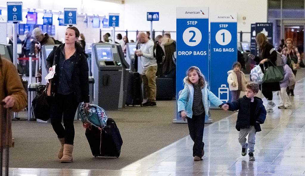 Travelers start the Thanksgiving holiday at John Wayne Airport in Santa Ana, CA, on Monday, November 24, 2025.