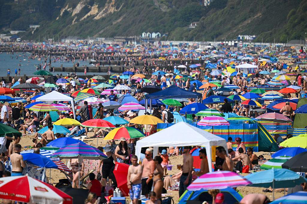 Visitors enjoy the hot weather at Bournemouth beach, on May 25, 2026 in Bournemouth, England.