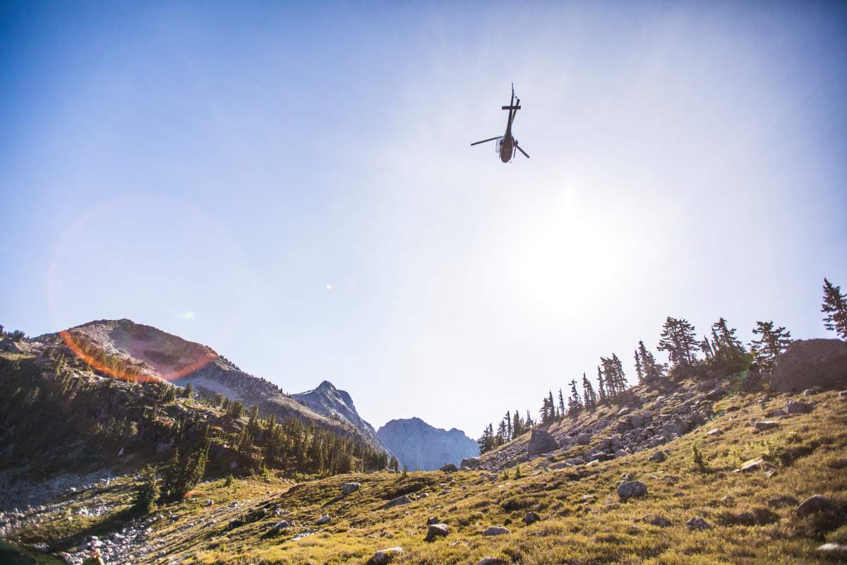 Helicopter flying above Douglas Peak, British Columbia, Canada.