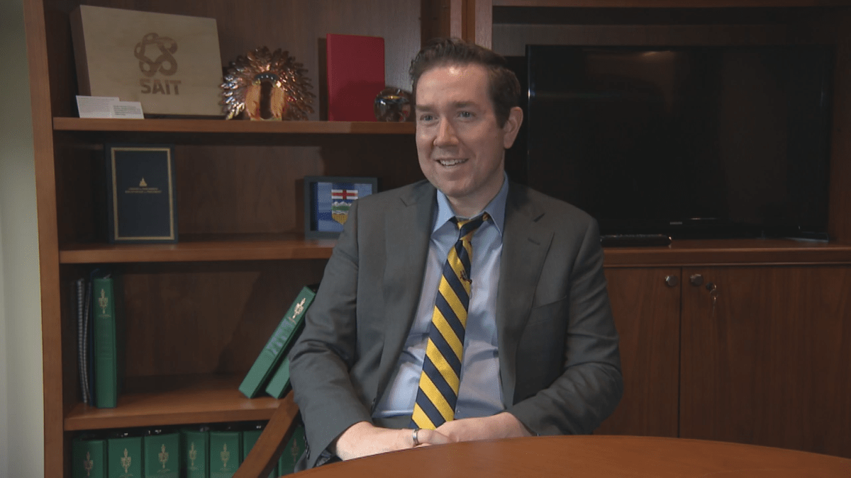 Calgary Confederation MP sits in his office