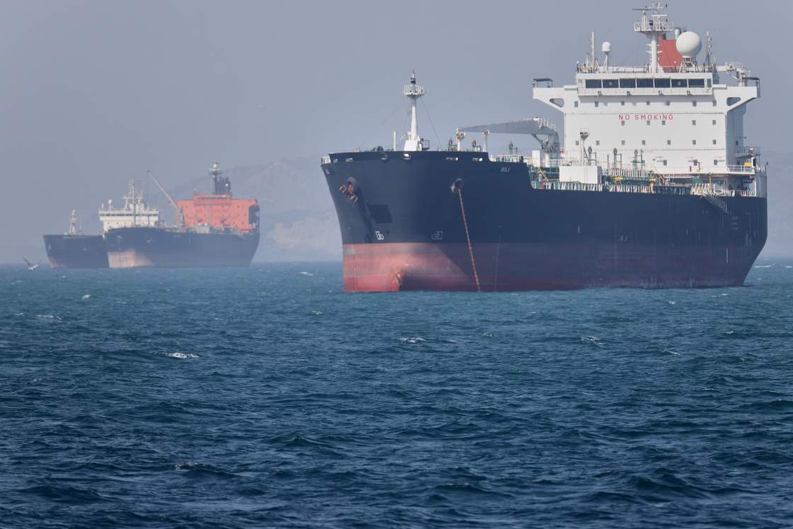 Oil tankers sit at anchor offshore in the Strait of Hormuz off Bandar Abbas, Iran, Saturday, May 2, 2026.