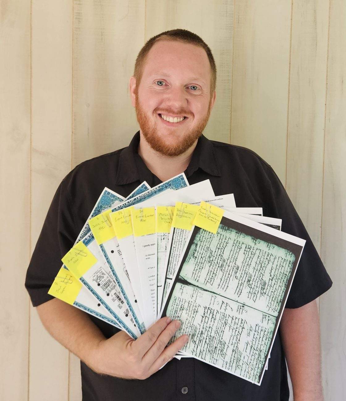 Stephen Redmond from Tennessee holds up documents he gathered for his application for Canadian citizenship in this undated handout photo.