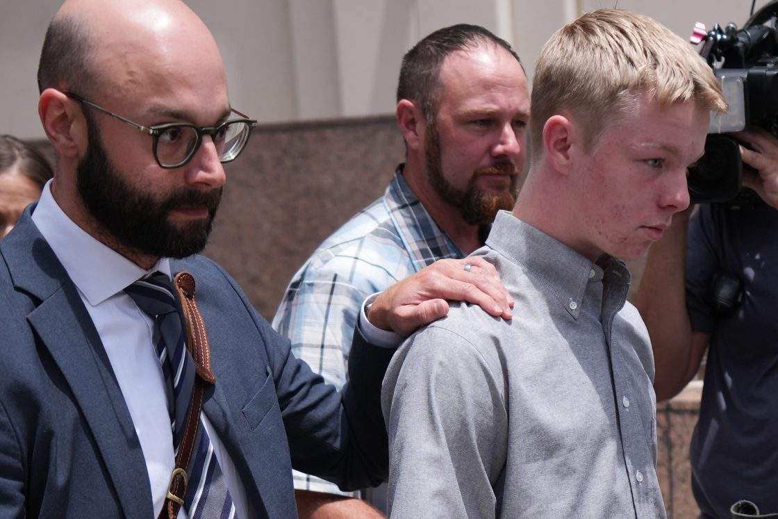 Timothy Hudson, right, charged with sexually assaulting and killing his 18-year-old stepsister on a Carnival Cruise ship, leaves following a hearing at the James Lawrence King Federal Justice Building, Wednesday, May 27, 2026, in Miami.