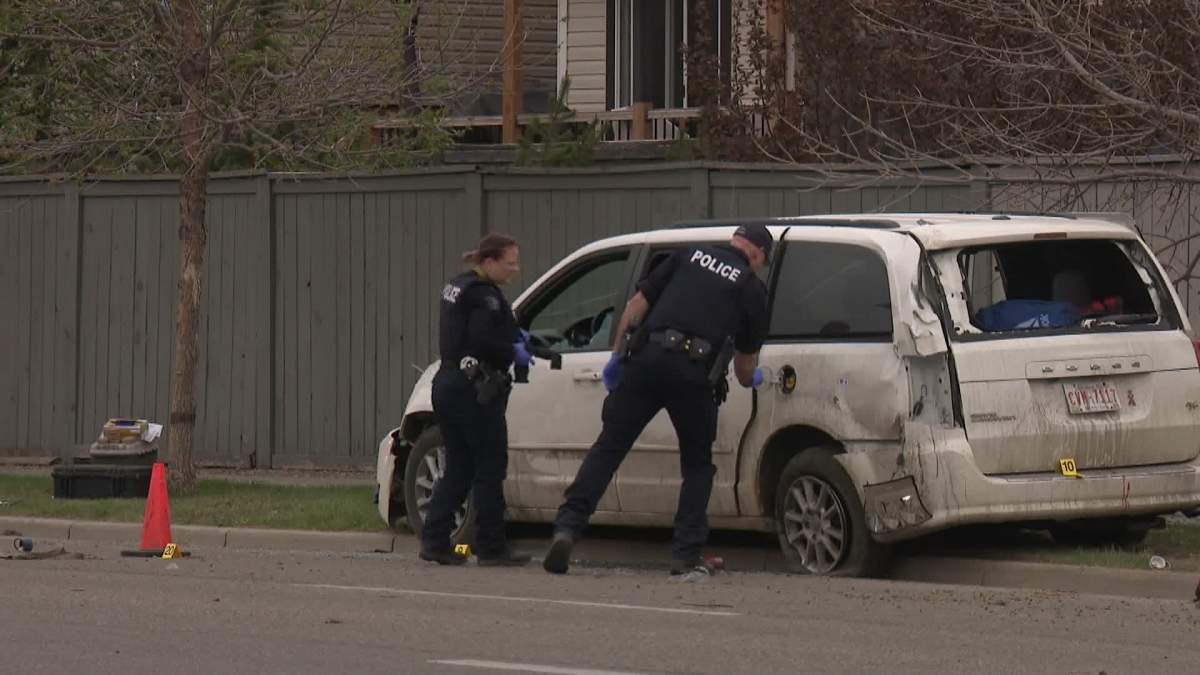 RCMP investigators are seen examining a minivan that appeared to be involved in the crash and shooting.