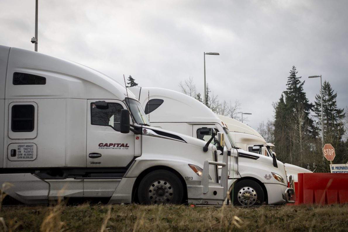 Trucks wait at the United States and Canada border in Surrey B.C., on March 4, 2025. THE CANADIAN PRESS/Ethan Cairns.