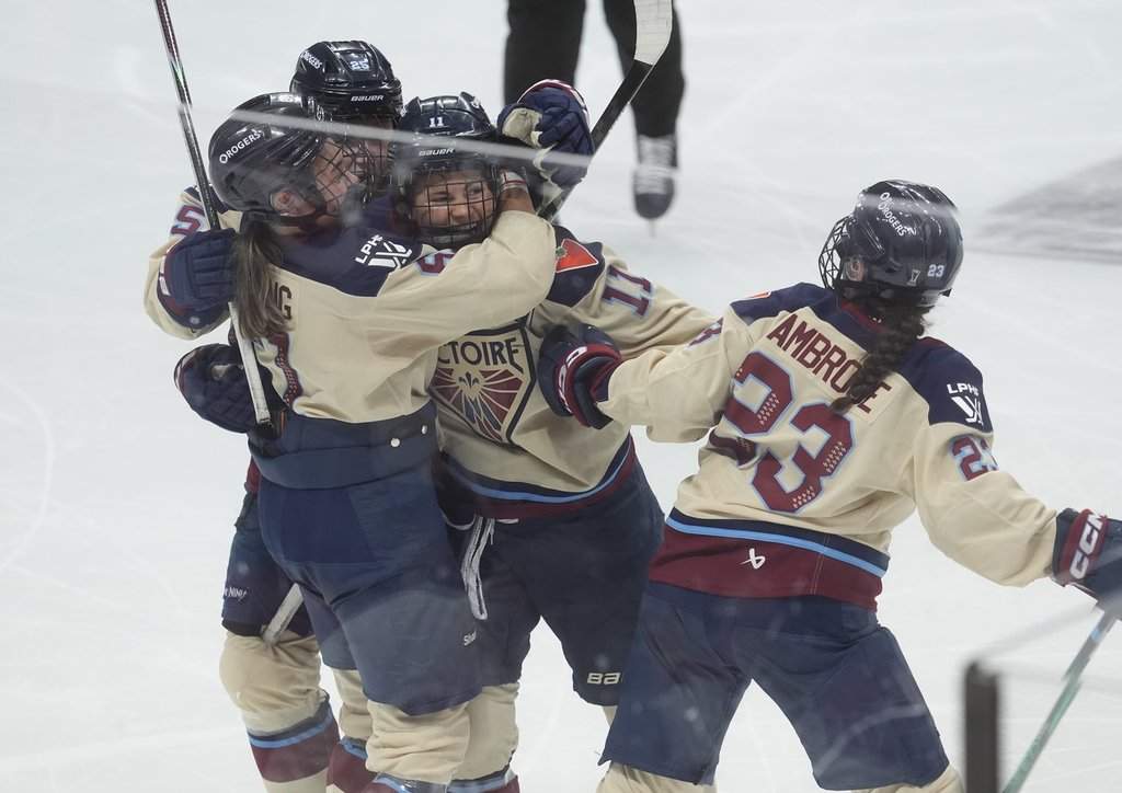 Montreal Victoire forward Abby Roque (11) celebrates her goal against the Ottawa Charge with teammates during third period PWHL Walter Cup final hockey action in Ottawa, Wednesday, May 20, 2026. THE CANADIAN PRESS/Adrian Wyld