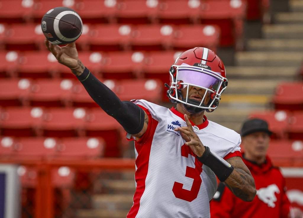 Calgary Stampeders quarterback Vernon Adams Jr. throws the ball during opening day of training camp in Calgary, Sunday, May 10, 2026. THE CANADIAN PRESS/Jeff McIntosh.